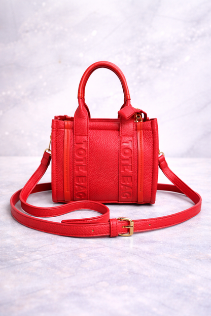Red mini tote on marble surface
