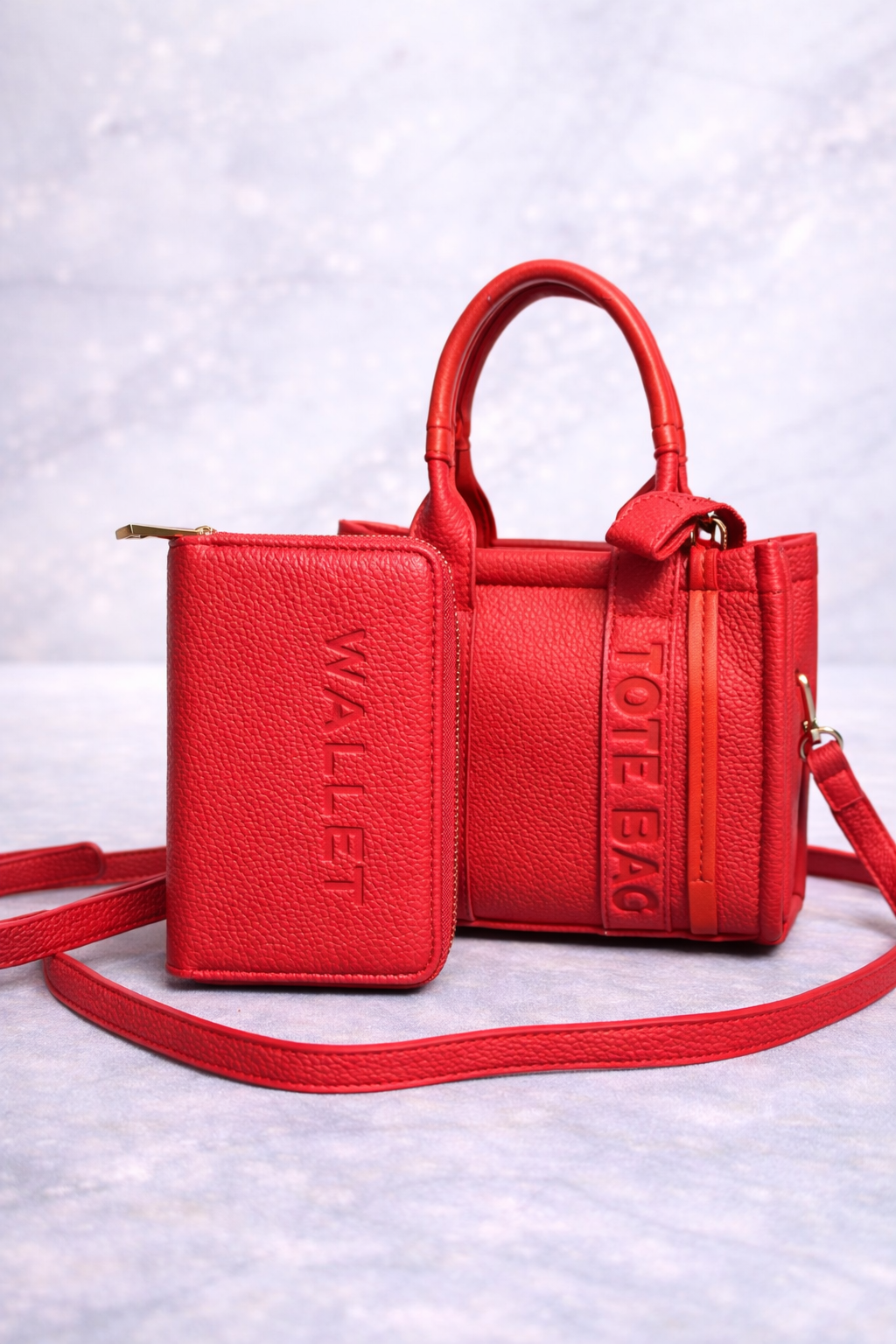 Red mini tote on marble surface